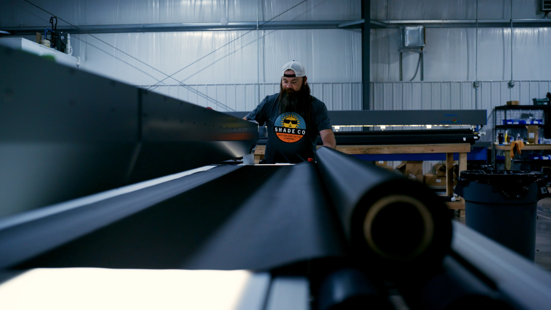 Shade Co fabricator loading a fabric roll